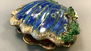 Shell-shaped ceramic dish.